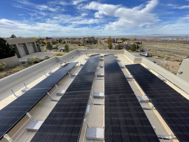 solar panels installed with ballasted weights on a flat roof