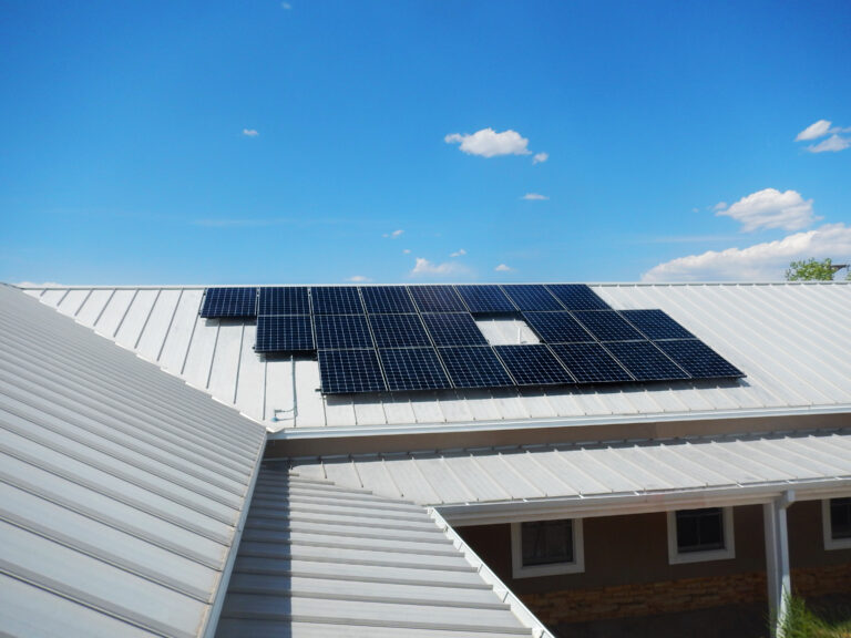 solar panels installed on a standing seam metal roof in Santa Fe, New Mexico