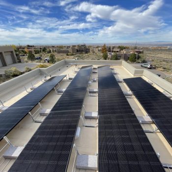 solar panels installed with ballasted weights on a flat roof